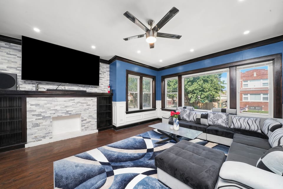 Living Room with 85 Inch Samsung 4K TV, Dolby Atmos Surround Sound, Sofa