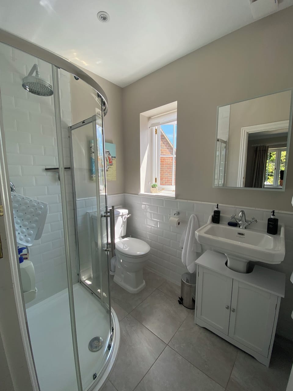 The ensuite has a 'waterfall' overhead shower plus a handheld option.