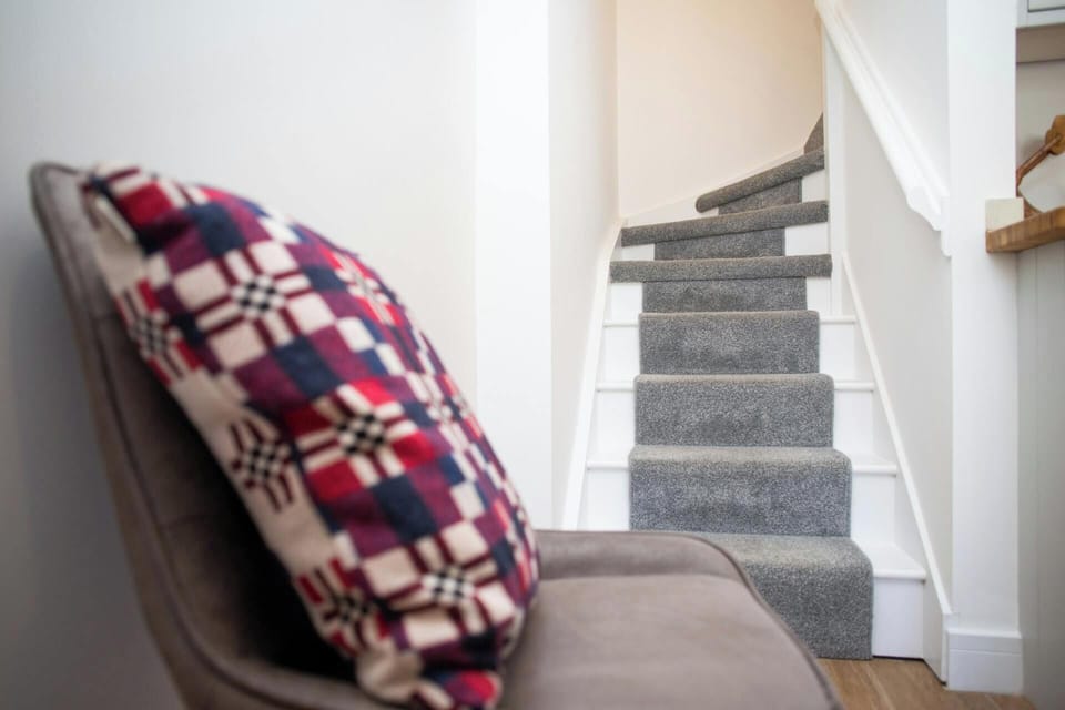 Stairs leading from the hall to the first floor
