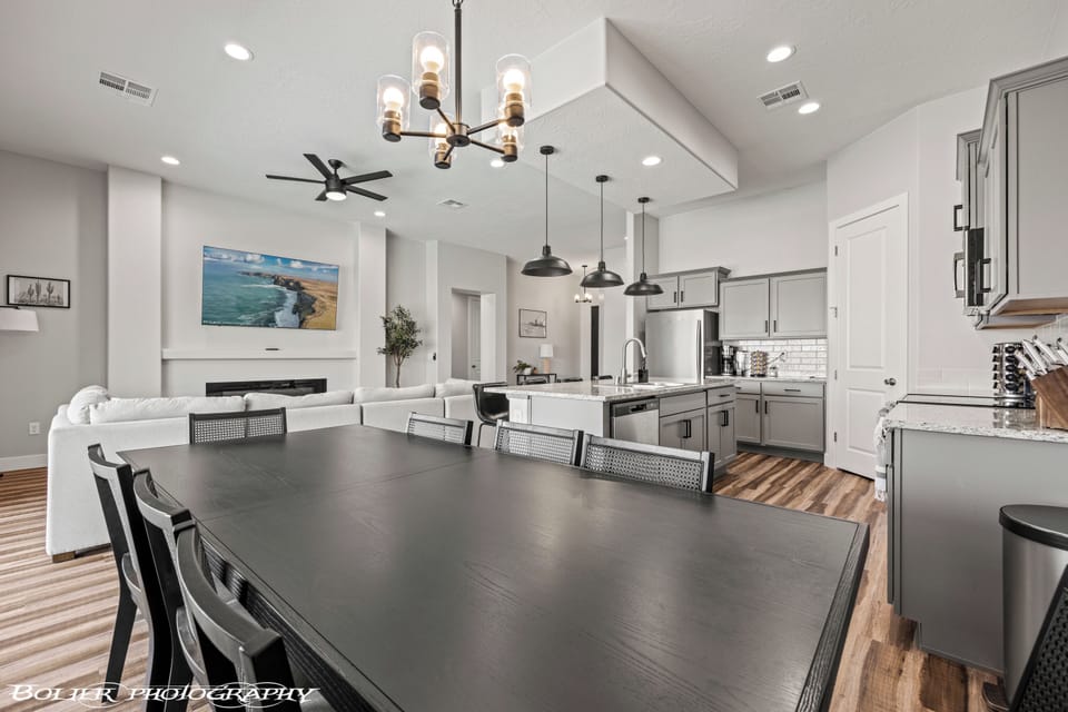 Dining table for 8! 4 barstools, and more seating outside! 75" 4K TV
