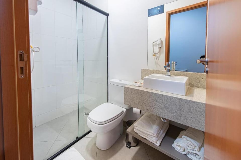 Shower, rainfall showerhead, towels, soap
