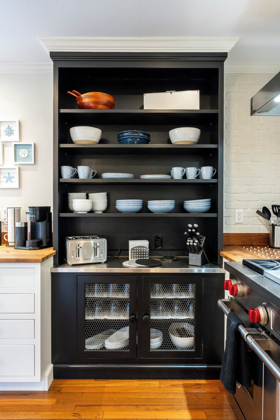 Chef's kitchen w/ Wolf Double oven, Bosch appliances & Sub-Zero wine fridge.