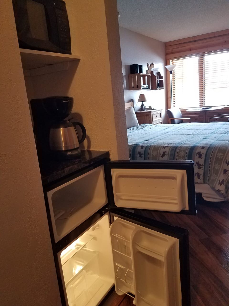 2 compartment mini frig/freezer, marble table with coffee service, microwave