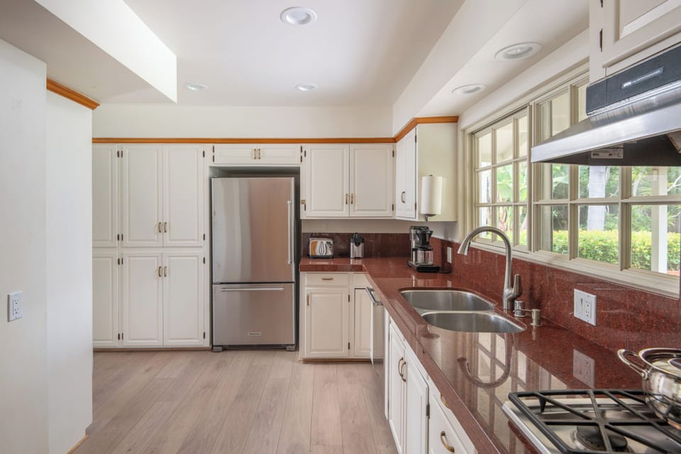 Full kitchen with oven stove, fridge and dishwasher. 