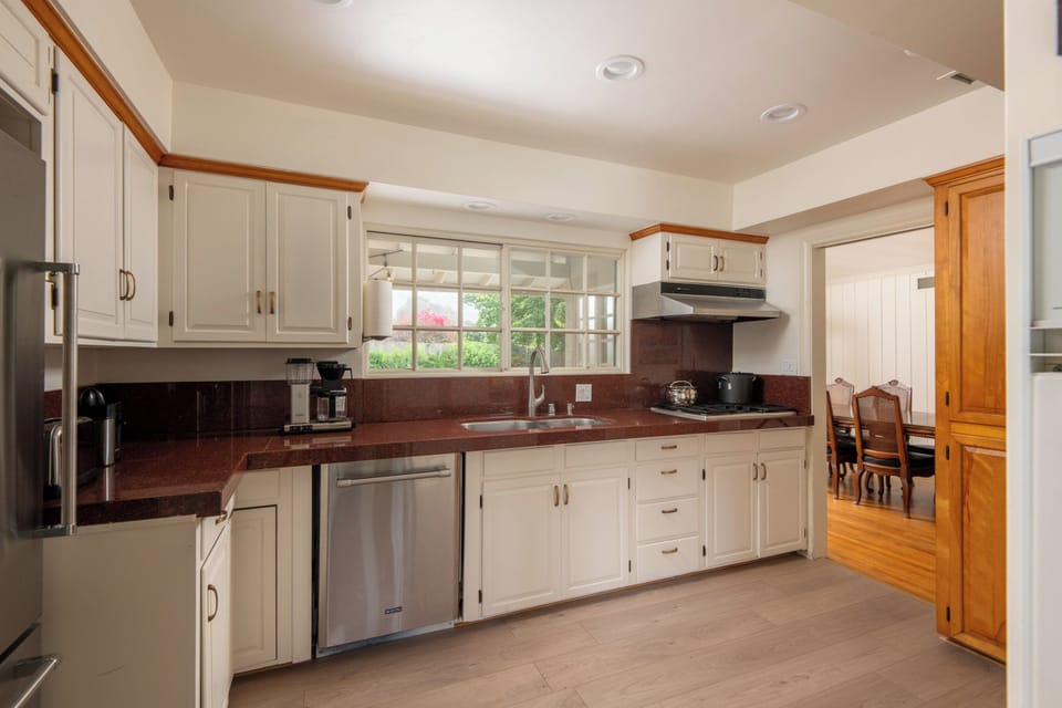 Full kitchen with oven stove, fridge and dishwasher. 