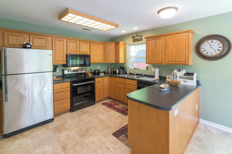Kitchen includes full-size appliances and island seating—ready for easy meal prep.