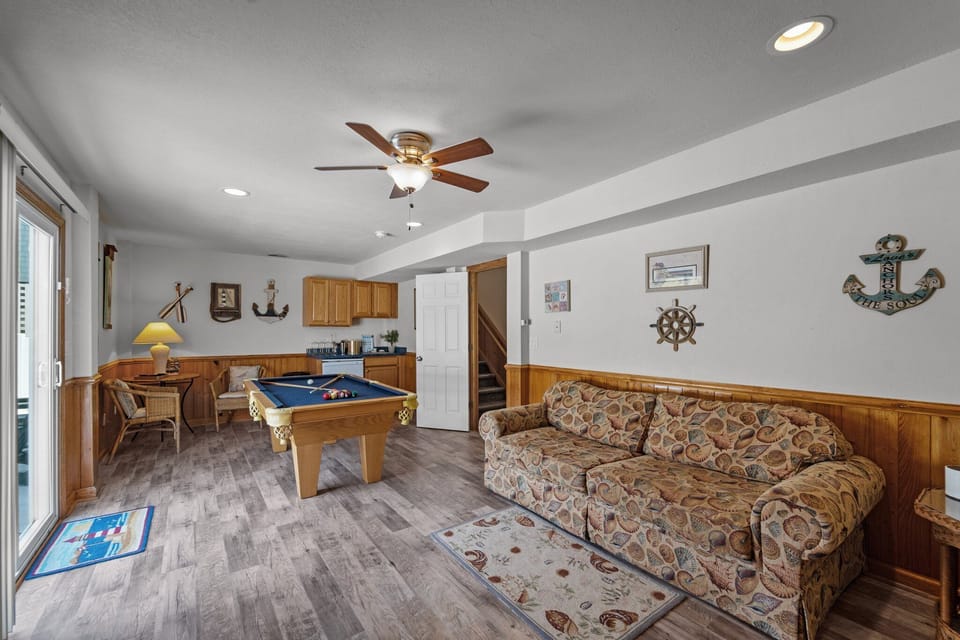 Ground-Level Rec Room with Pool Table, Wet Bar, and Deck Access