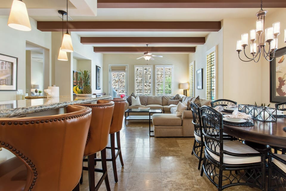 The modern kitchen seamlessly blends into the dining area for a perfect open-concept living experience.