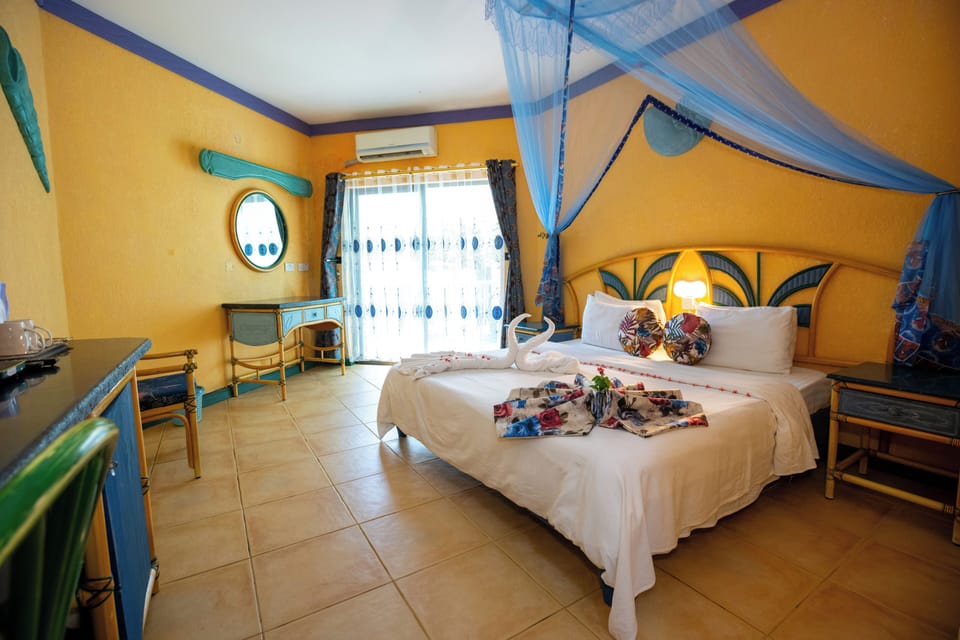 Deluxe Double Room Single Use, 1 Bedroom, Balcony, Partial Ocean View | Premium bedding, minibar, in-room safe, individually decorated