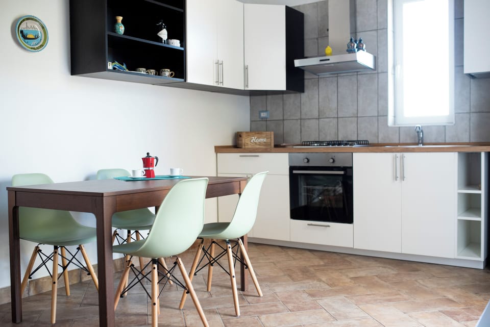 Trezene | Private kitchen | Stovetop, highchair, cookware/dishes/utensils, cleaning supplies