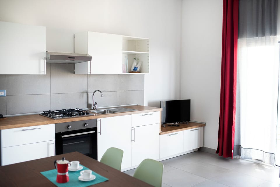 Tresino | Private kitchen | Stovetop, highchair, cookware/dishes/utensils, cleaning supplies