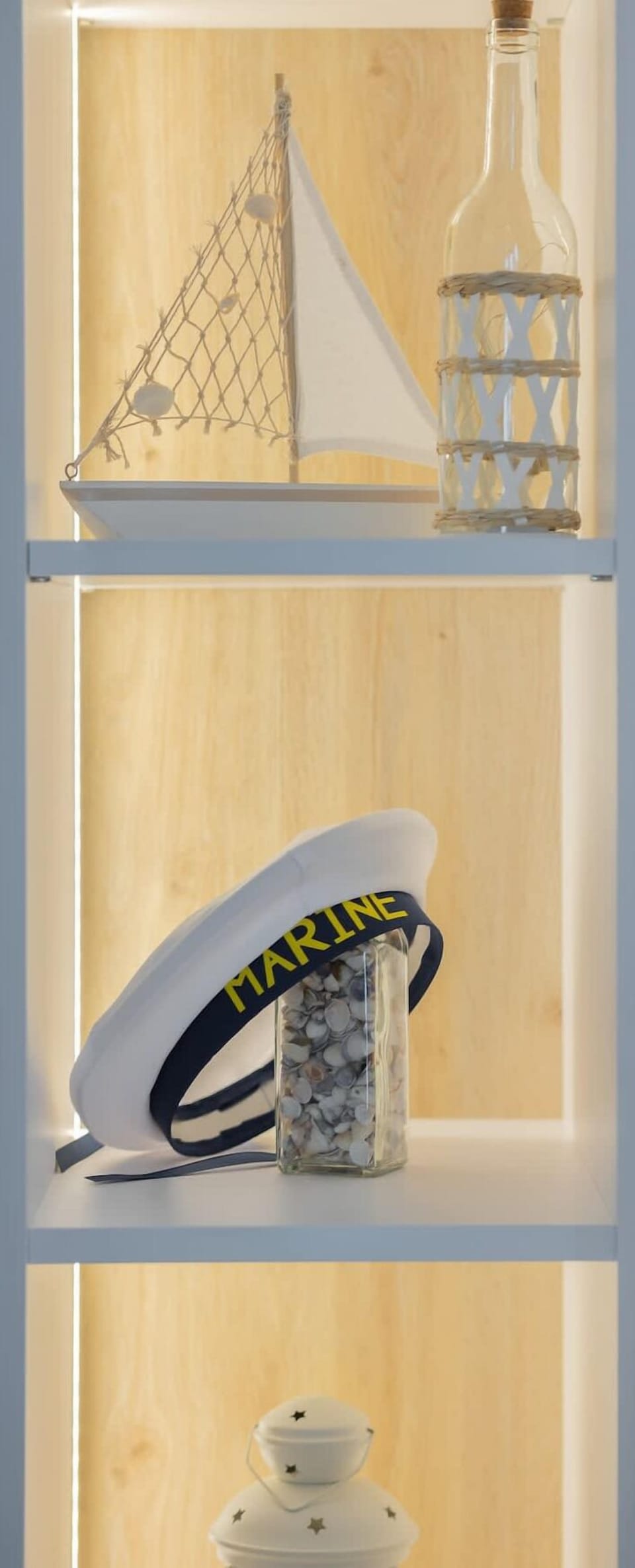 A shelf with an iron and decorative items combines functionality with an aesthetic touch to the interior.

