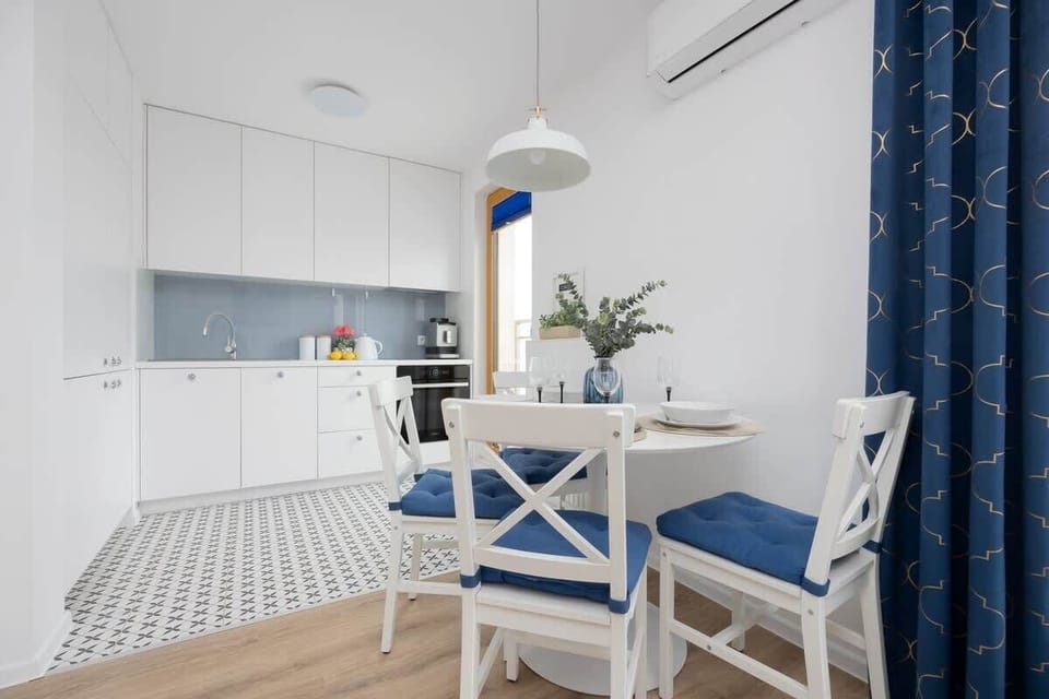 An open kitchen with a dining area encourages shared cooking and conversations over meals.