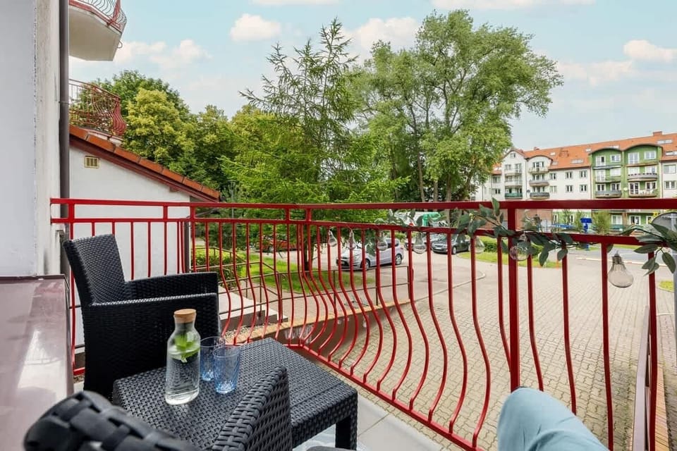 The balcony's stylish design complements the apartment's decor. 
