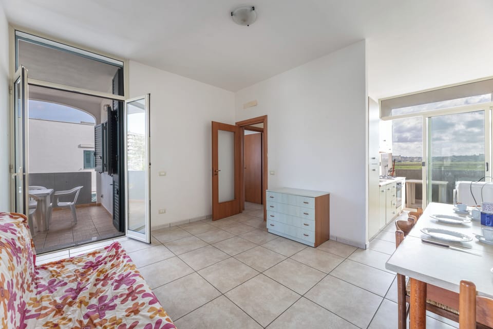Apartment, Balcony, City View | Living area | 32-inch TV with cable channels