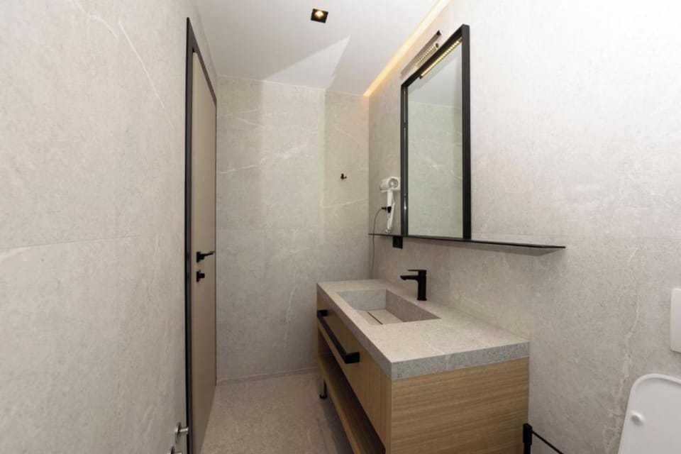 Hair dryer, slippers, towels, soap