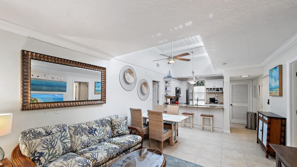 Enjoy casual dining beneath the vaulted ceiling and skylight, perfectly situated between the comfortable living area and the granite countertop kitchen, maximizing the coastal ambiance.