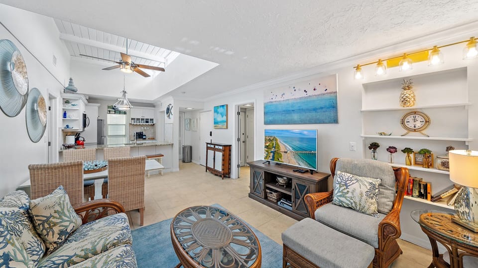 Experience the light and airy "Just Beachy" vibe of this beautifully decorated space, connecting the living area, kitchen, and dining for the ultimate Longboat Key open-concept stay.