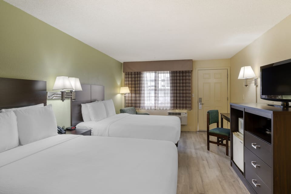 Deluxe Room, 2 Queen Beds | Pillowtop beds, desk, blackout drapes, iron/ironing board