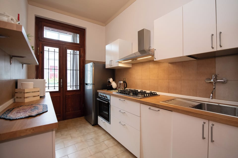 Comfort Apartment | Private kitchen | Full-size fridge, microwave, oven, dishwasher