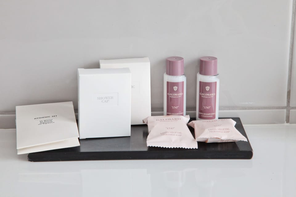 Shower, rainfall showerhead, hair dryer, towels