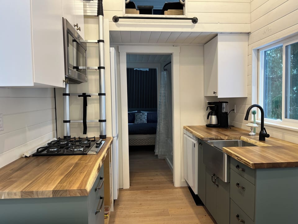 Kitchen with dishwasher, gas stove, fridge/freezer, microwave.  