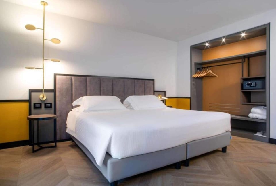 Deluxe Room, Multiple Beds, Non Smoking (Converts to 2 Twin Beds) | Hypo-allergenic bedding, minibar, in-room safe, desk