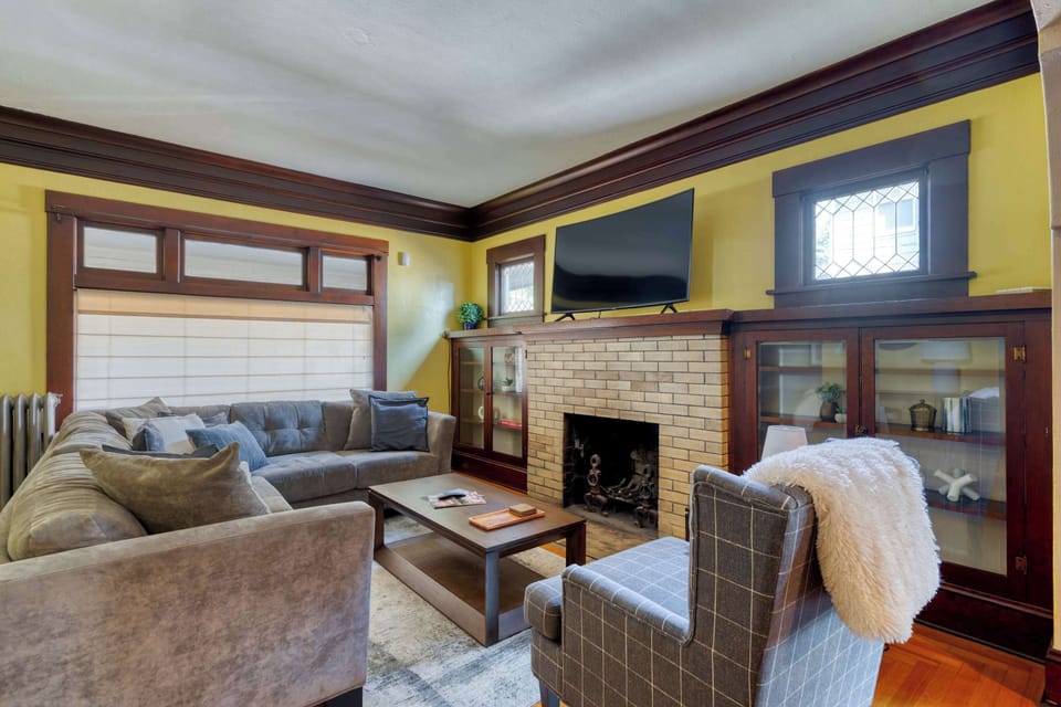 Living room with fireplace and TV.