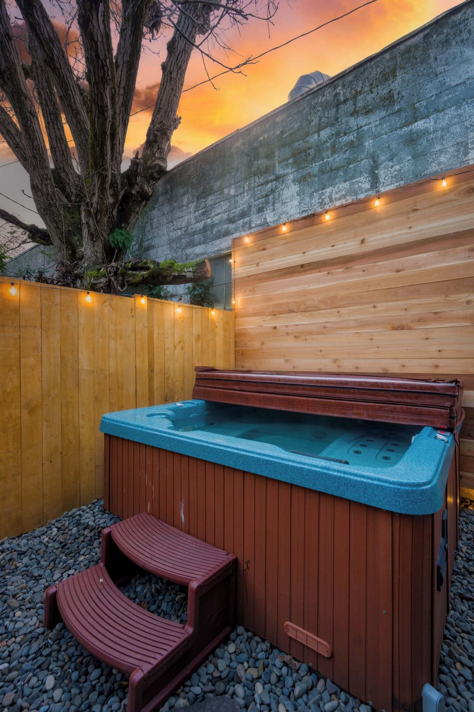 Hot tub with privacy fence.