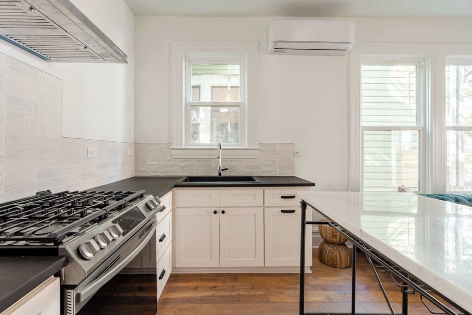 Kitchen with dining counter and bright window.