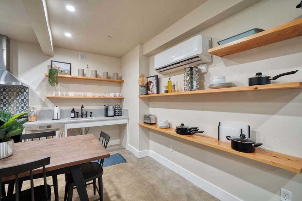 Coffee station, cookware, and a ductless mini-split keeping it cool