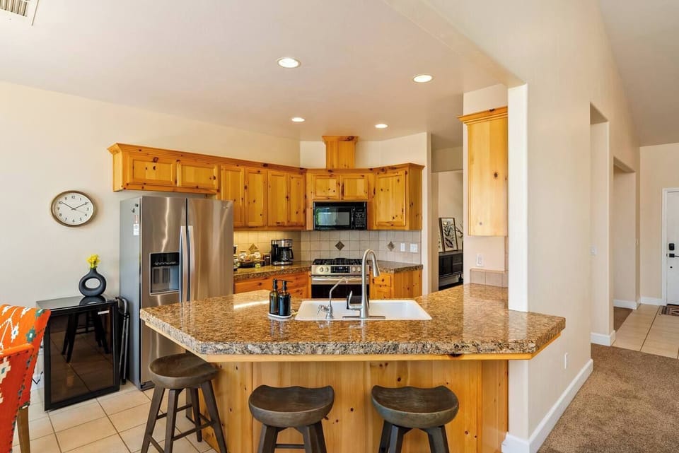 Serenity Vista Retreat includes a full kitchen with plenty of pantry space for groceries, wine cooler, waffle maker, toaster oven, and more!