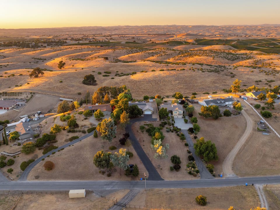 Serenity Vista Retreat includes a full acre for you to enjoy. The expansive front yard includes a mini orchard with stone fruits of all kinds. Come in the summer to experience a private you-pi