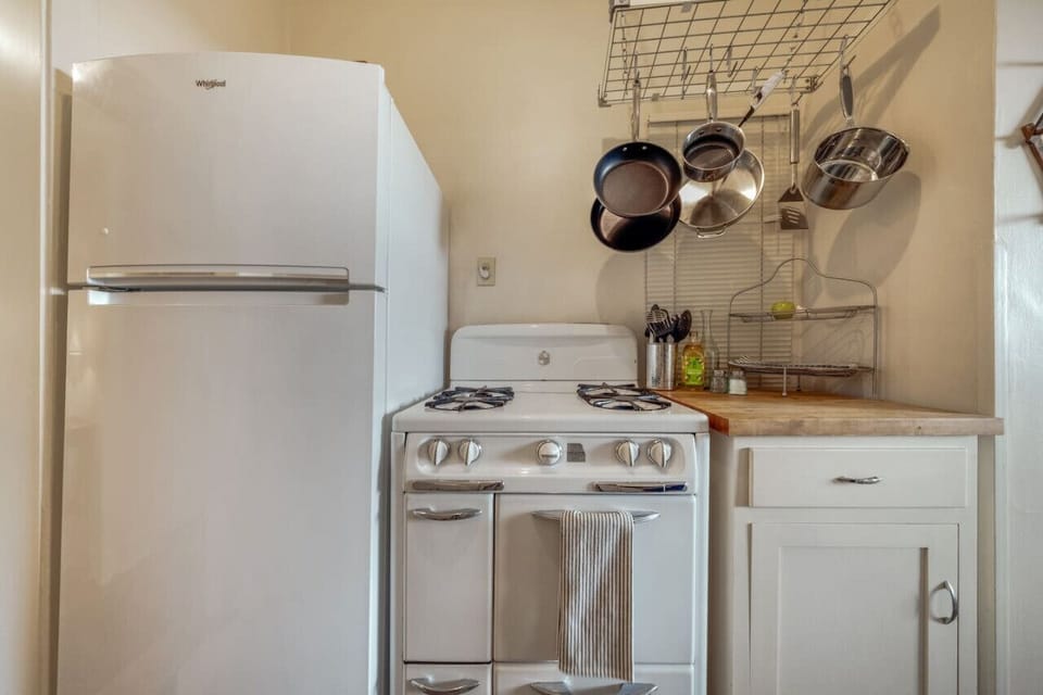 Quaint, well-appointed kitchen, stocked and ready for your stay (no dishwasher)