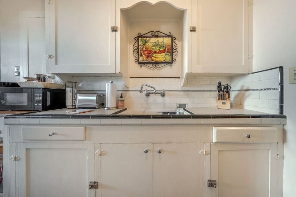 Well-appointed kitchen, fully stocked and ready for your stay (no dishwasher)