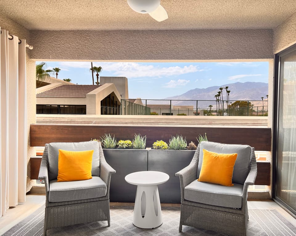 Private balcony with mountain views.