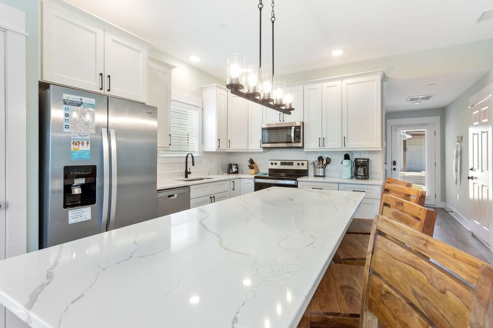 Whip up something delicious in the Kitchen with modern appliances and snack at the counter bar!