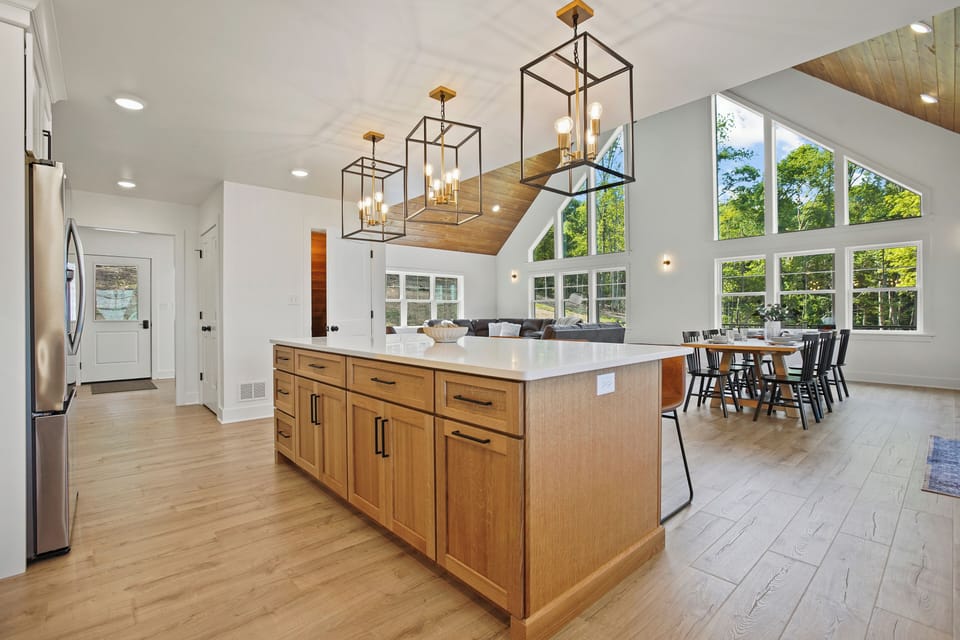 The spacious kitchen is equipped with new stainless steel appliances, pots and pans, and all cooking and baking utensils that you will need during your stay!