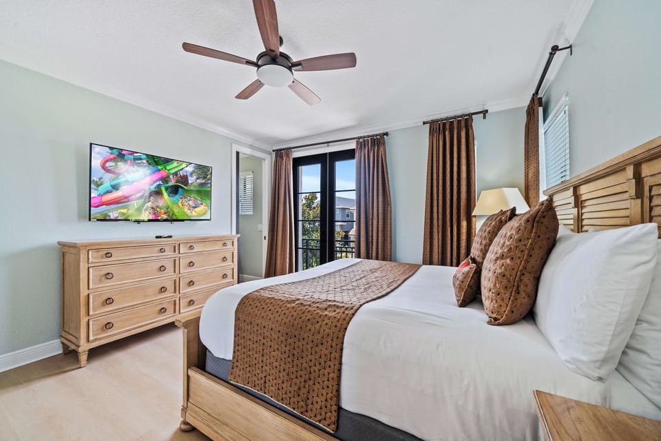 Bright bedroom with balcony access adds a resort feel.