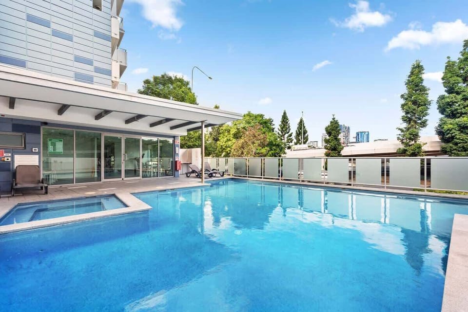 The building pool + sauna, next to main road