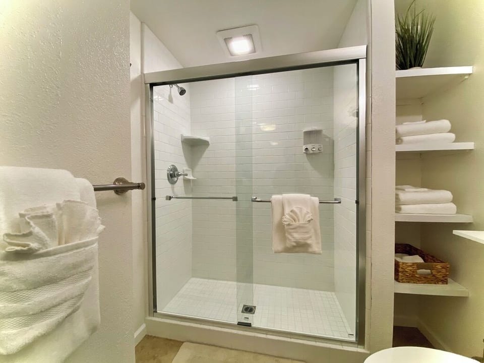 Bathroom 1 is fully stocked and clean with tile throughout.