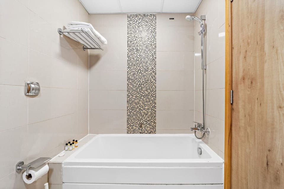 Bathroom: Modern elegance with a soaking tub and stylish mosaic accent wall!