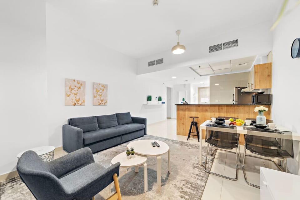 Living Room: Bright and airy space with modern decor, perfect for relaxing after Dubai adventures!