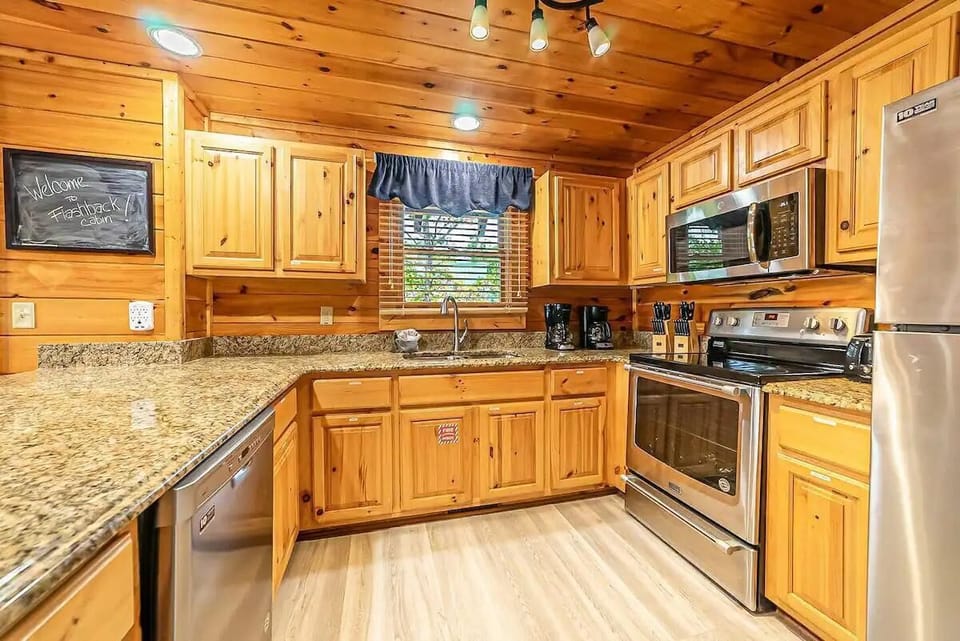 Cook up a feast with modern appliances and warm wood accents in this charming kitchen!