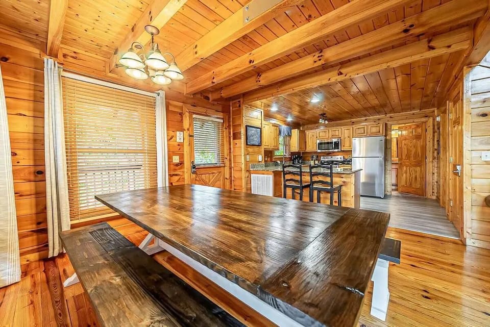 Gather around the rustic table and enjoy delicious meals in this inviting space!