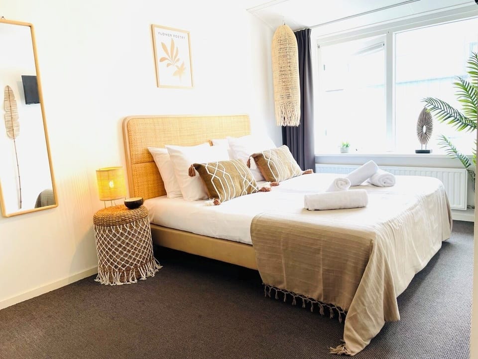 Enjoy a stylish and cozy room with warm natural decor, soft lighting, and inviting comfort. Thoughtful details and a relaxing ambiance create the perfect setting for your stay, whether you're unwinding or exploring nearby attractions