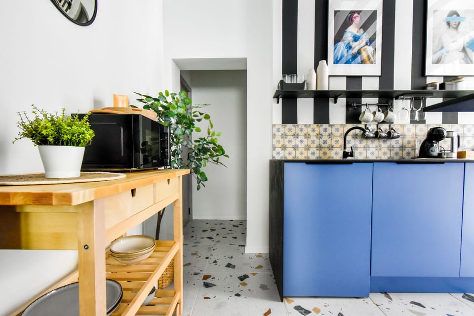 Modern Kitchen Convenience: Cook to your heart's content in the fully equipped kitchen, featuring an oven, stovetop, microwave, and a Dolce Gusto capsule coffee machine.