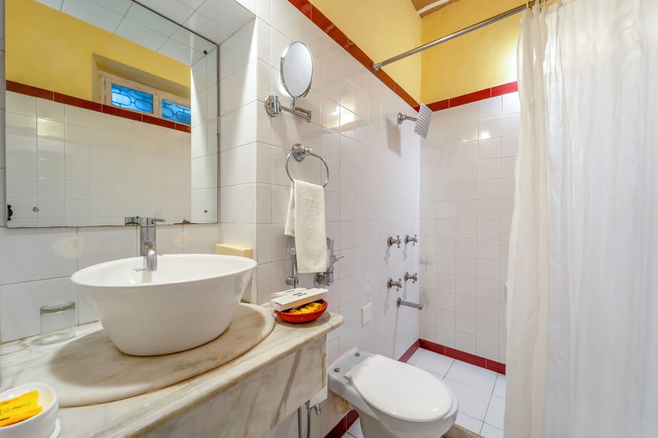 Deluxe Double Room, Balcony, Mountain View | Bathroom | Combined shower/tub, hair dryer, soap, shampoo
