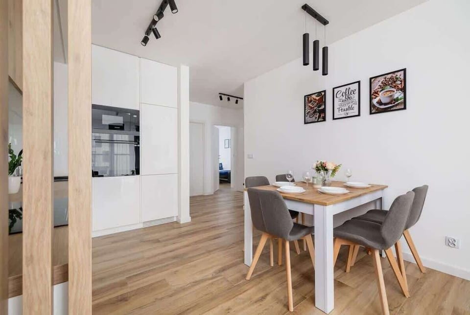 The sleek design of the kitchenette blending seamlessly with the living area.