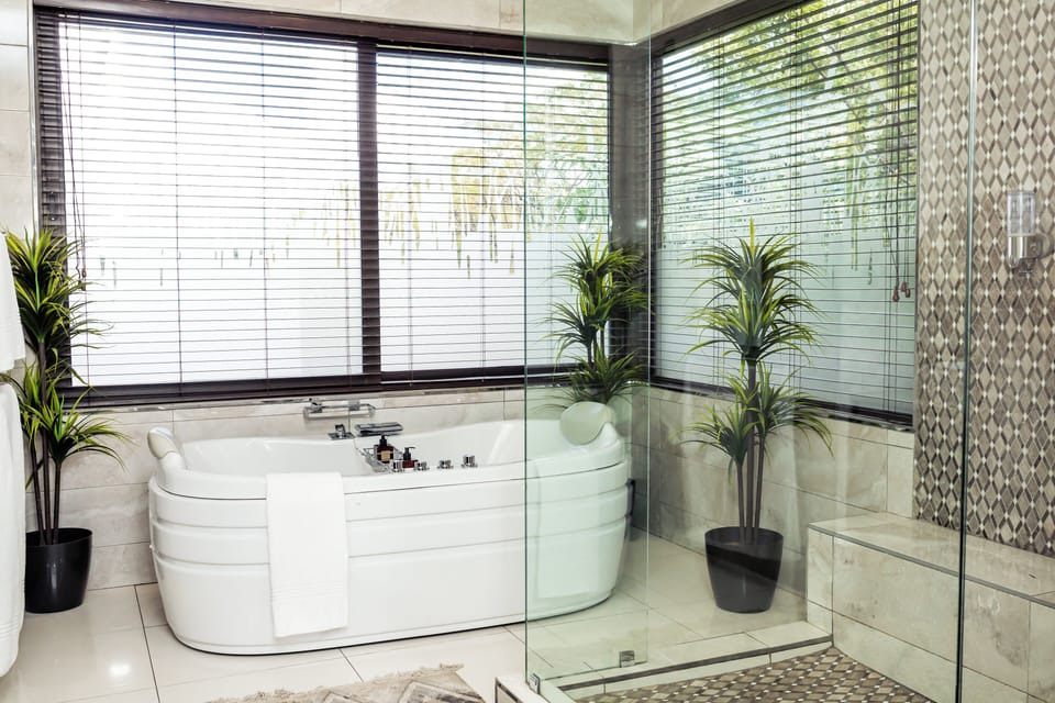 Presidential Suite, Lake View | Bathroom | Shower, free toiletries, hair dryer, bathrobes